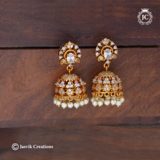 Classic Gold Plated White AD Stone Jhumka Earrings with Pearl Hangings - JCER637